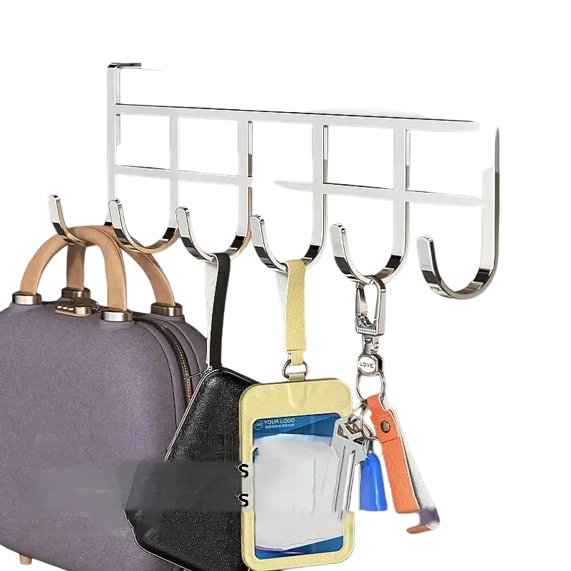 Silver metal door hook with five curved hooks over the bed holding bags and keys for organized storage