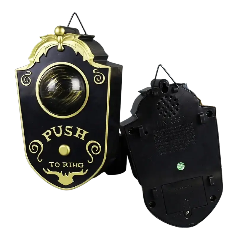 Black and gold ornate bell-shaped doorbell haunted horror prop with push-to-ring mechanism made in mainland china