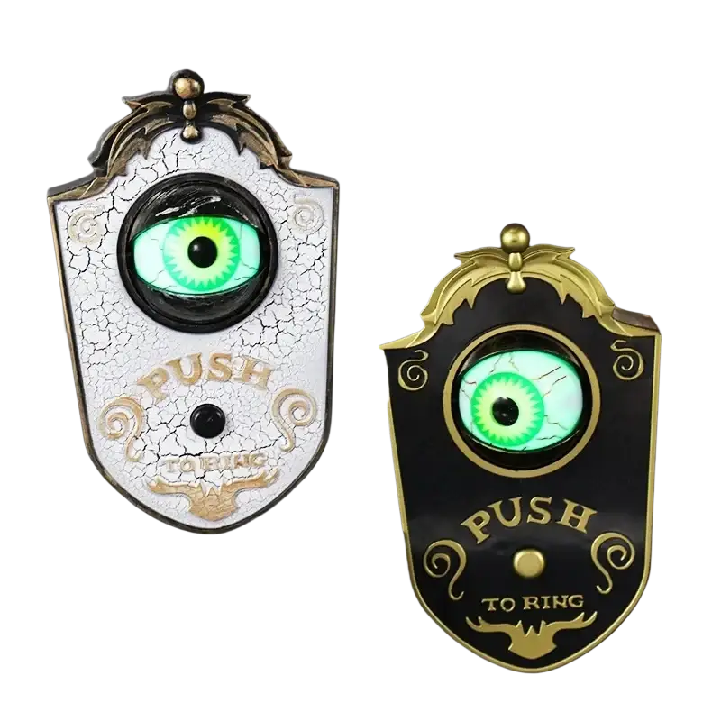 Two ornate doorbell haunted horror props with glowing green eyes and push to ring inscriptions from mainland china