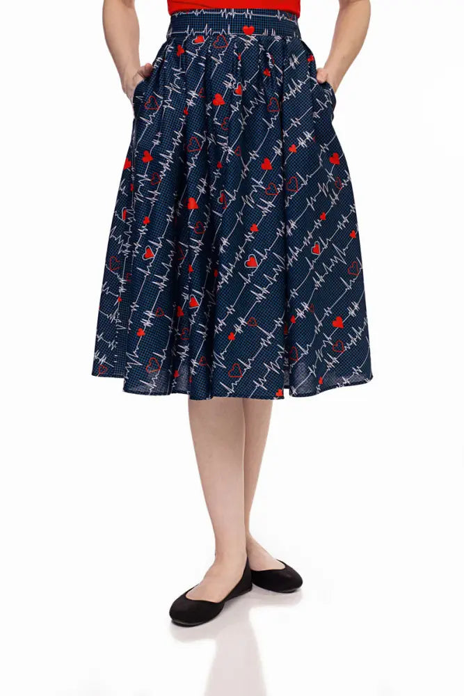 Doris navy pleated heartbreaker skirt with pockets featuring red hearts and white electrocardiogram lines print
