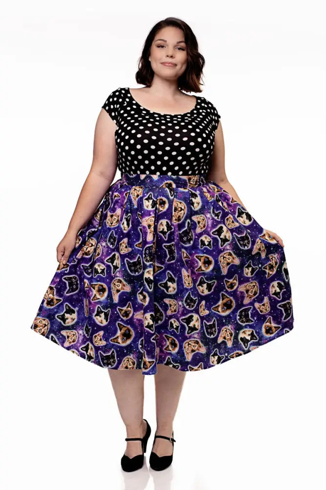 Purple a line skirt with galaxy print featuring various colorful cat faces in a vintage space cats design
