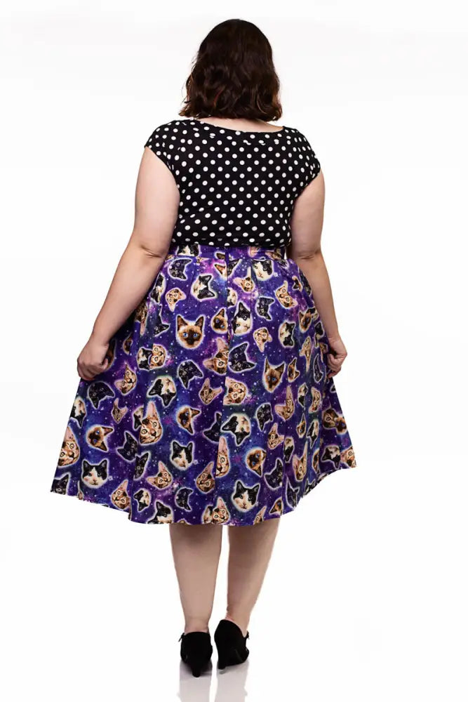 Purple a line skirt featuring a vibrant space cats galaxy print pattern on a cosmic galaxy backdrop