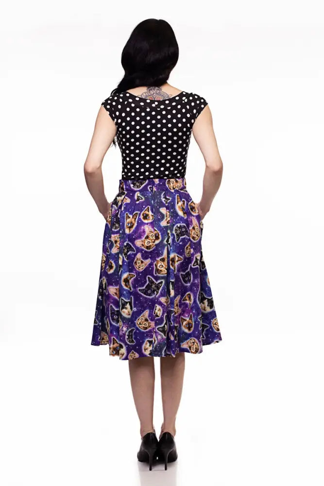 A vibrant purple a line skirt with space cats galaxy print featuring cartoon dogs and cats on a starry background