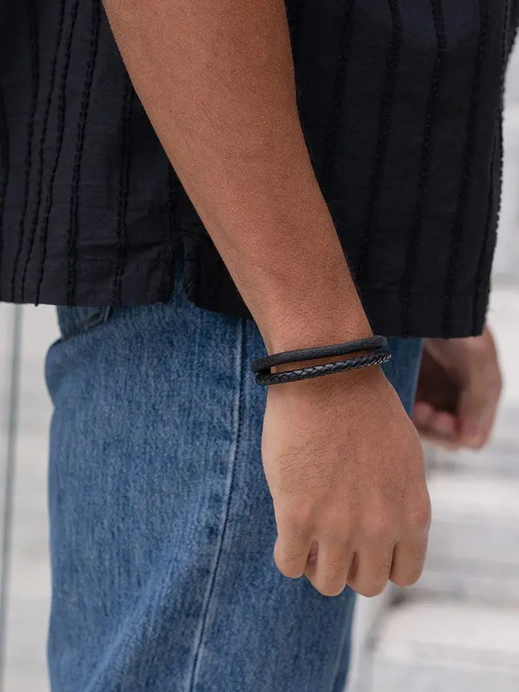Black braided leather bracelet with subtle metallic accent in double black suede and braided leather steel design
