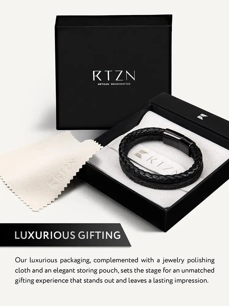Black braided leather bracelet with sleek black magnetic clasp in elegant Rtzn artisan handcrafted packaging
