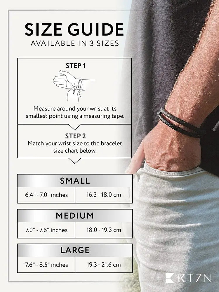 Black braided leather steel bracelet with double black suede detail worn on a mans wrist