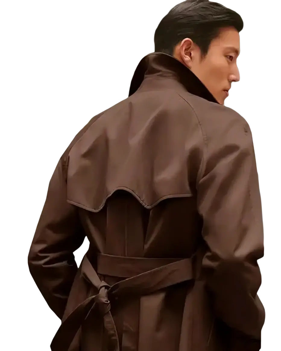 A sleek dark brown double breasted mens trench coat with a belted waist and wavy seam detail mid length winter jacket