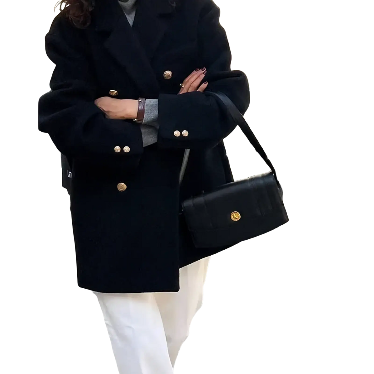 Black leather crossbody bag with gold tone hardware complements double breasted wool coat for winter wear