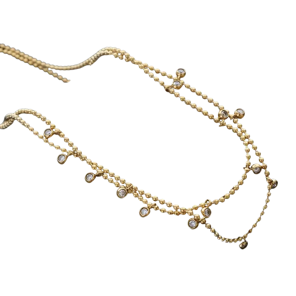 Gold-toned double choker crystal beaded necklace in stainless steel displayed on a beige presentation box