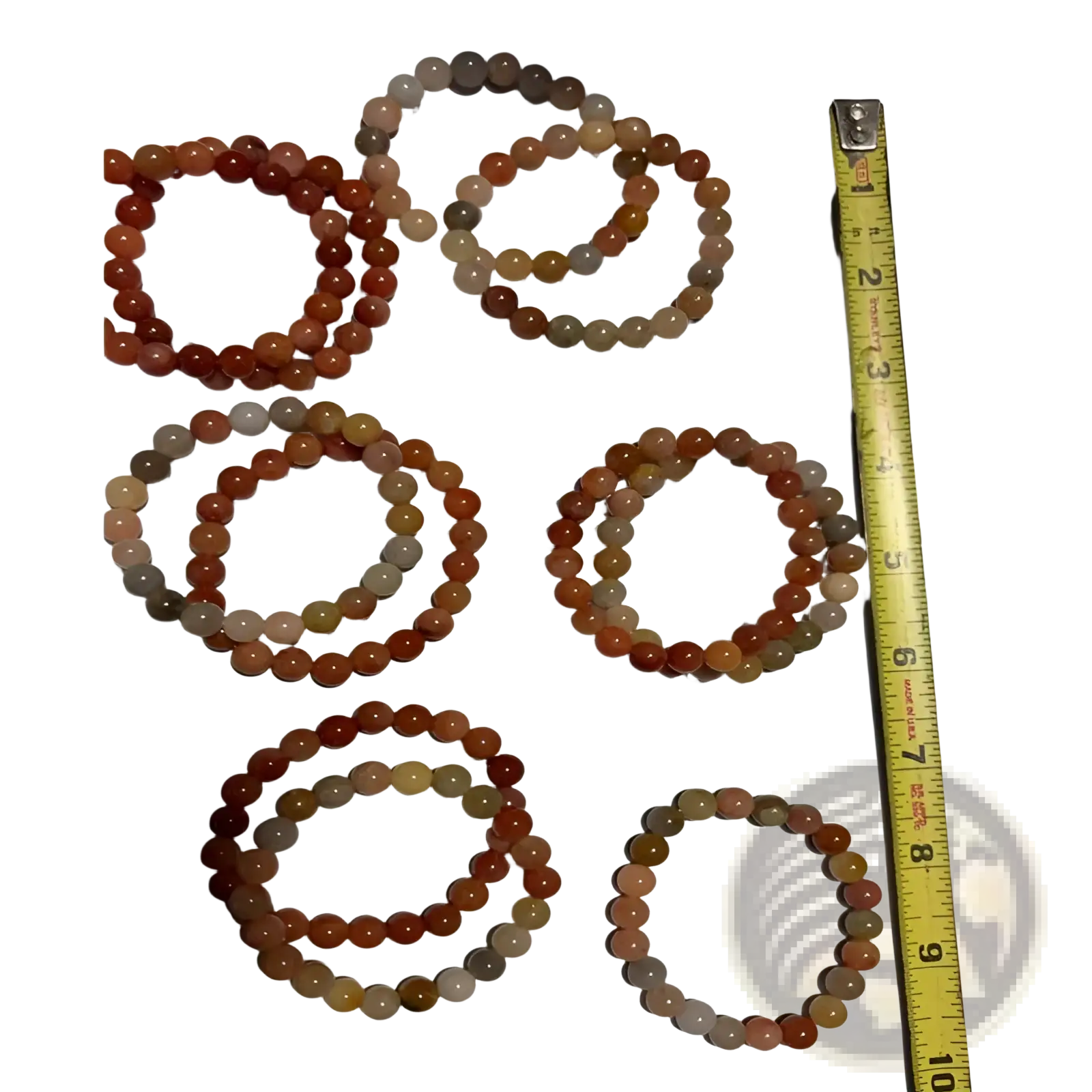 Seven handcrafted double happiness carnelian and tiger eye beaded bracelets with smooth round stones in warm orange hues