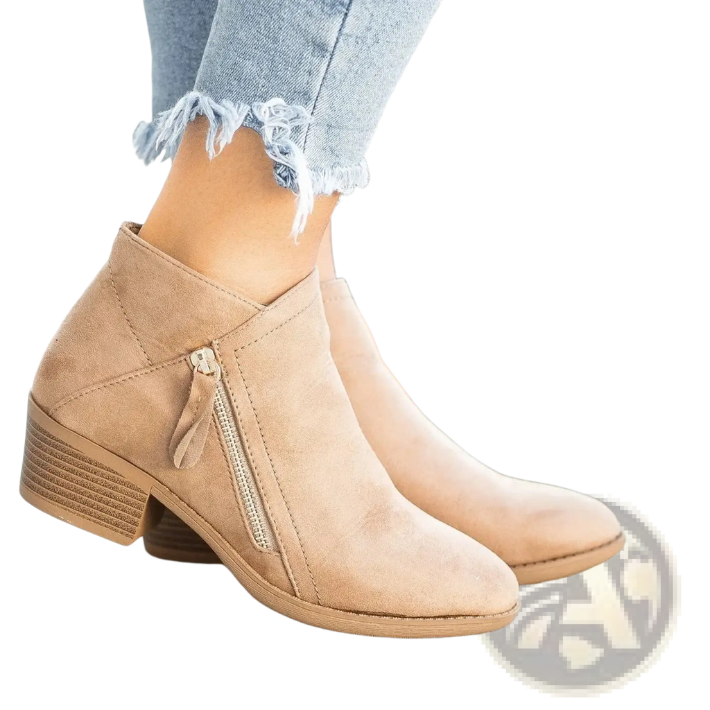 Tan suede dr martens ankle boot with low chunky heel and side zipper closure shown from the back side