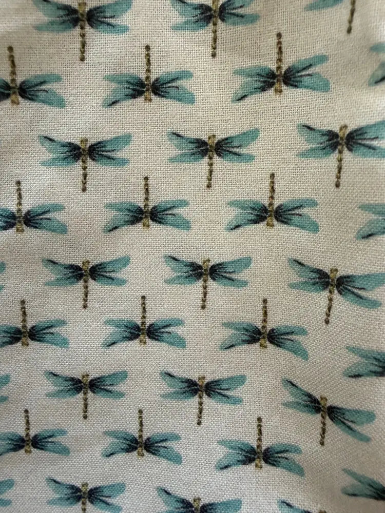 Retro dragonfly bow cotton blouse featuring light blue dragonfly patterned fabric on cream colored background