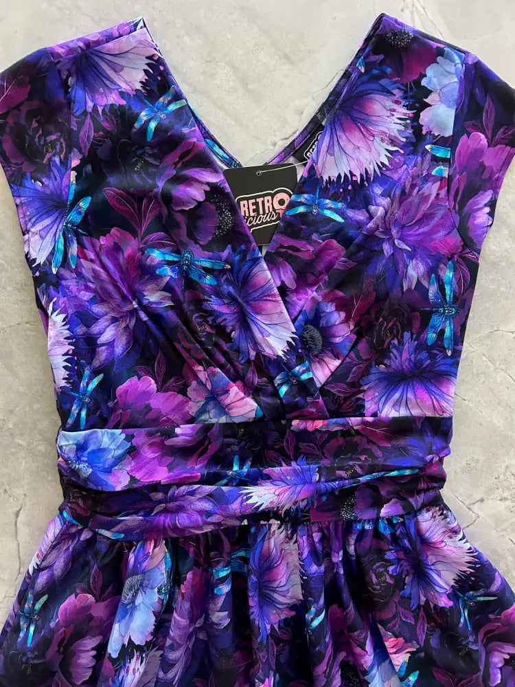 Dragonfly floral greta v-neck cotton flare dress in vibrant purple and blue with sleeveless v-neckline and cinched waist