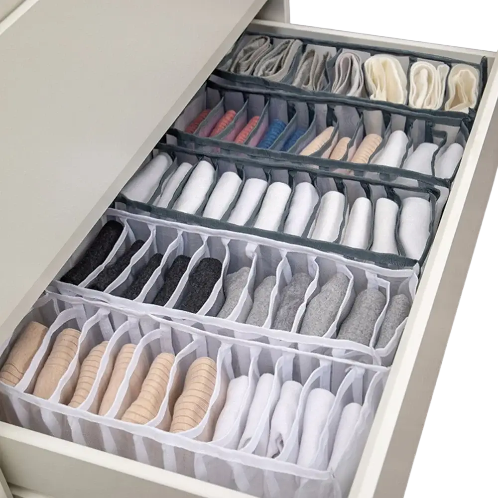 Gray and white mesh drawer divider organizer with multiple compartments for neatly storing folded socks underwear and bras