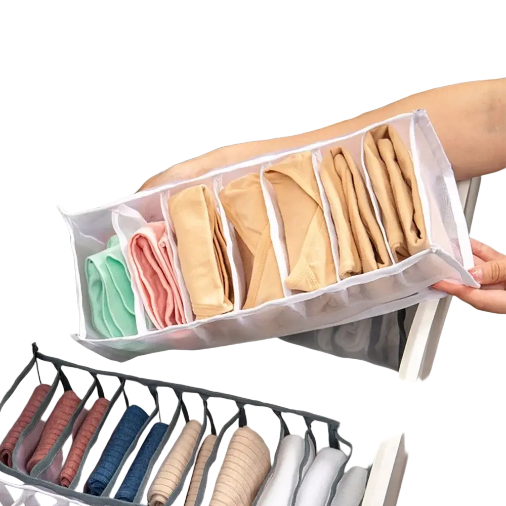 Transparent plastic drawer divider organizer with multiple compartments holding neatly folded colorful underwear