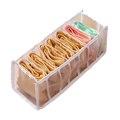 Transparent plastic drawer divider organizer with seven compartments holding colorful folded underwear for storage