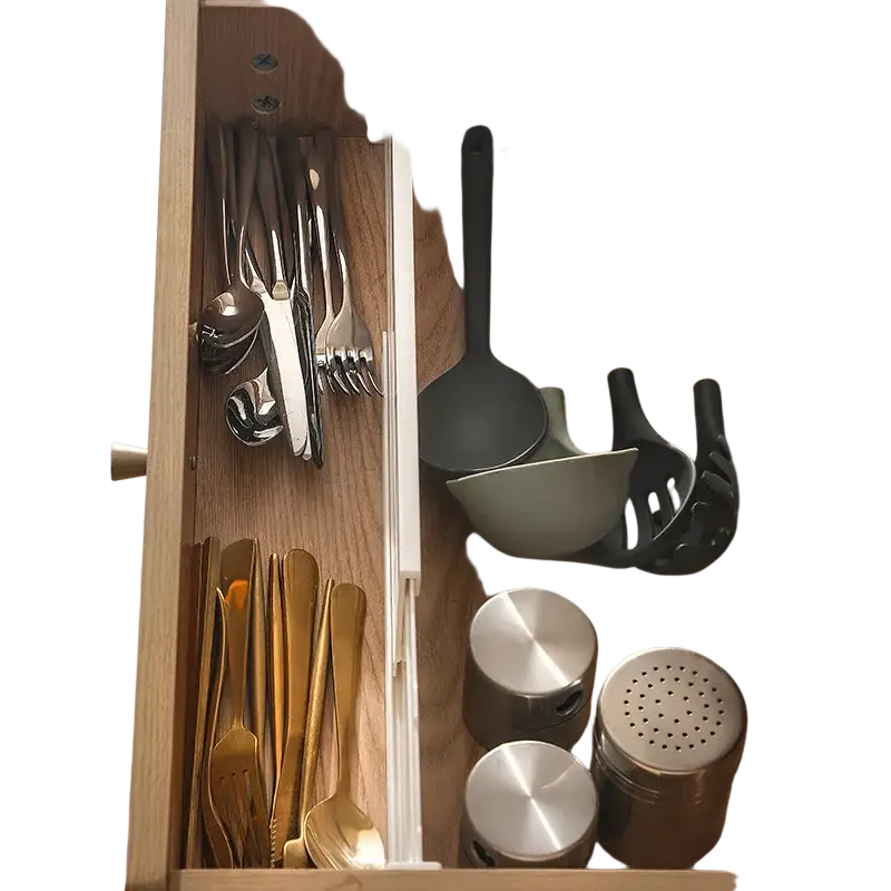 Organized wooden drawer with stainless steel and gold-toned cutlery, black silicone utensils using drawer organizer divider