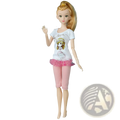 A blonde dress up doll wearing a white t-shirt with cartoon girl print and pink ruffled shorts for kids