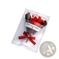Red dried flower greeting card bouquet wrapped in silver foil and tied with matching ribbon on white card