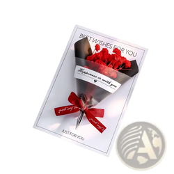 Red dried flower greeting card bouquet wrapped in silver foil and tied with matching ribbon on white card