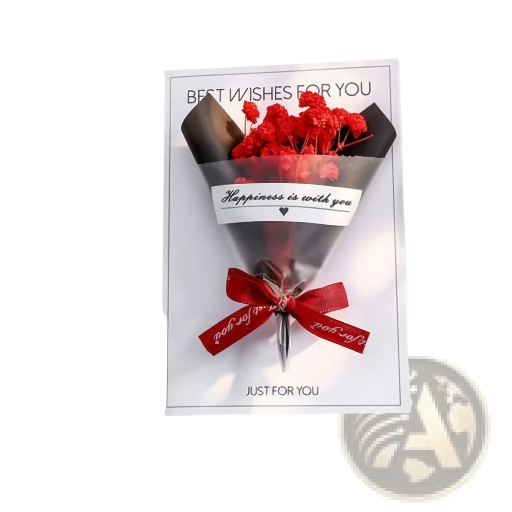 A handmade dried flower greeting card bouquet with compact red dried flowers wrapped in clear cellophane and red ribbon
