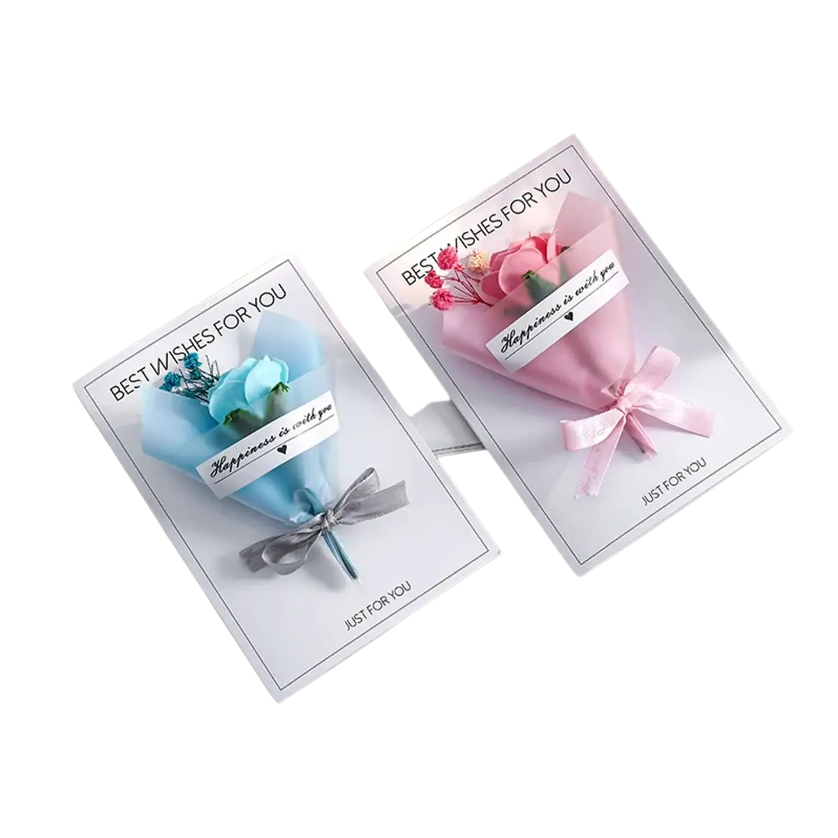 Two handmade dried flower greeting card gift bouquets wrapped in pastel paper with matching ribbon bows on white cards
