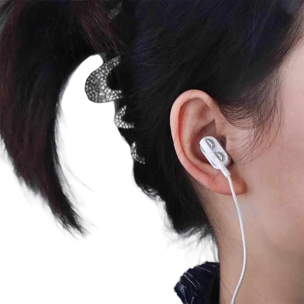 White 3.5mm wired dual dynamic earphones with a sleek minimalist design and subtle branding on the outer casing