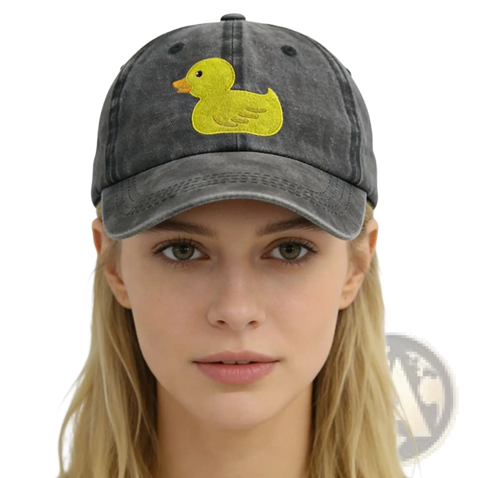 A faded gray distressed denim baseball cap featuring a bright yellow embroidered duck on the front