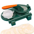 Dumpling maker 3 in 1 manual dough pressing tool with green plastic body, orange handle, and white circular mold