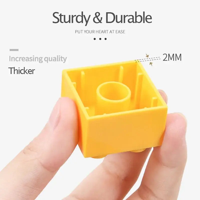 Duplo compatible bright yellow plastic building block 2mm thick with central hole and raised side tabs for kids