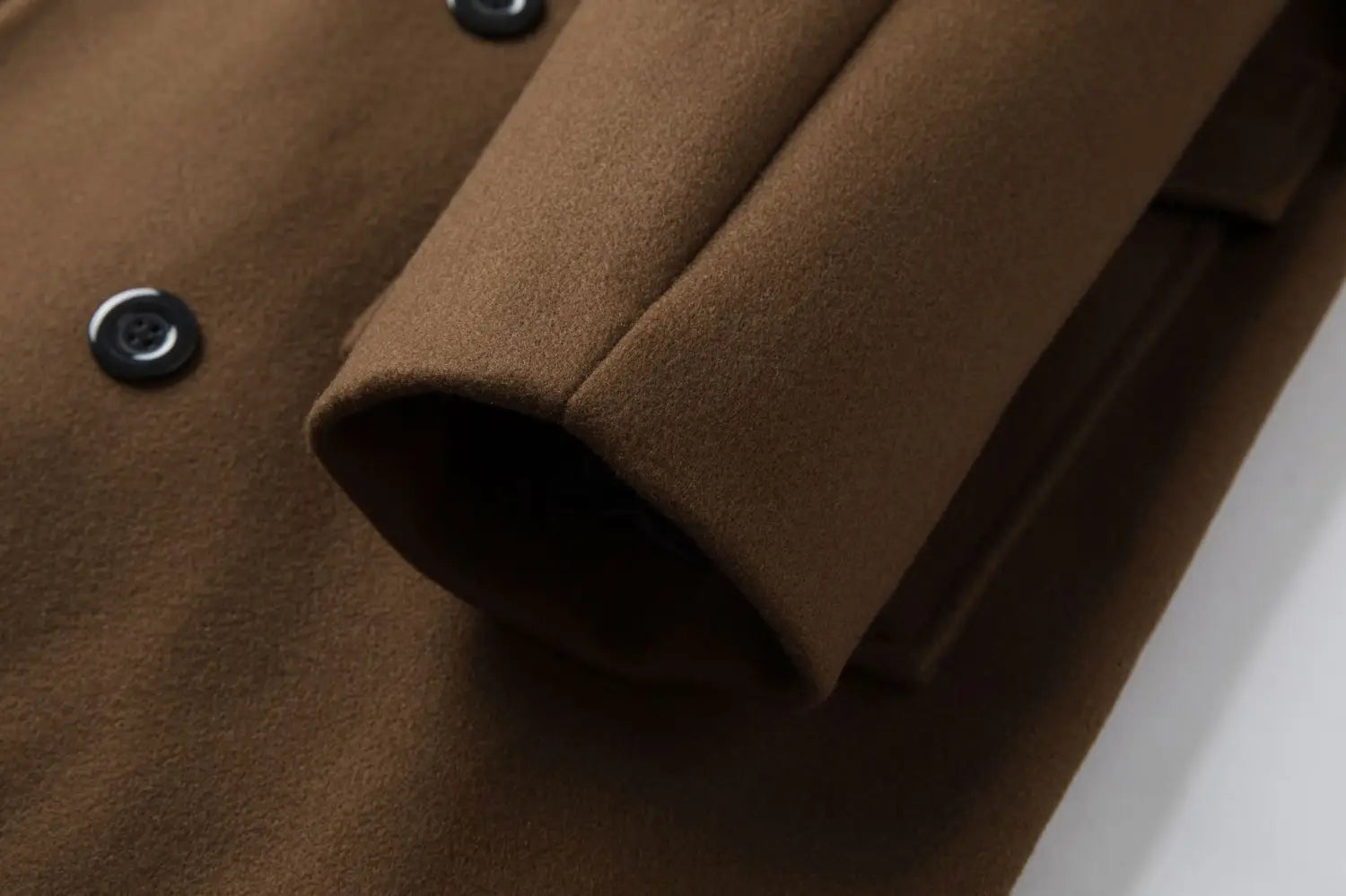 Men double breasted mid length brown woolen overcoat featuring black buttons for formal and casual wear.