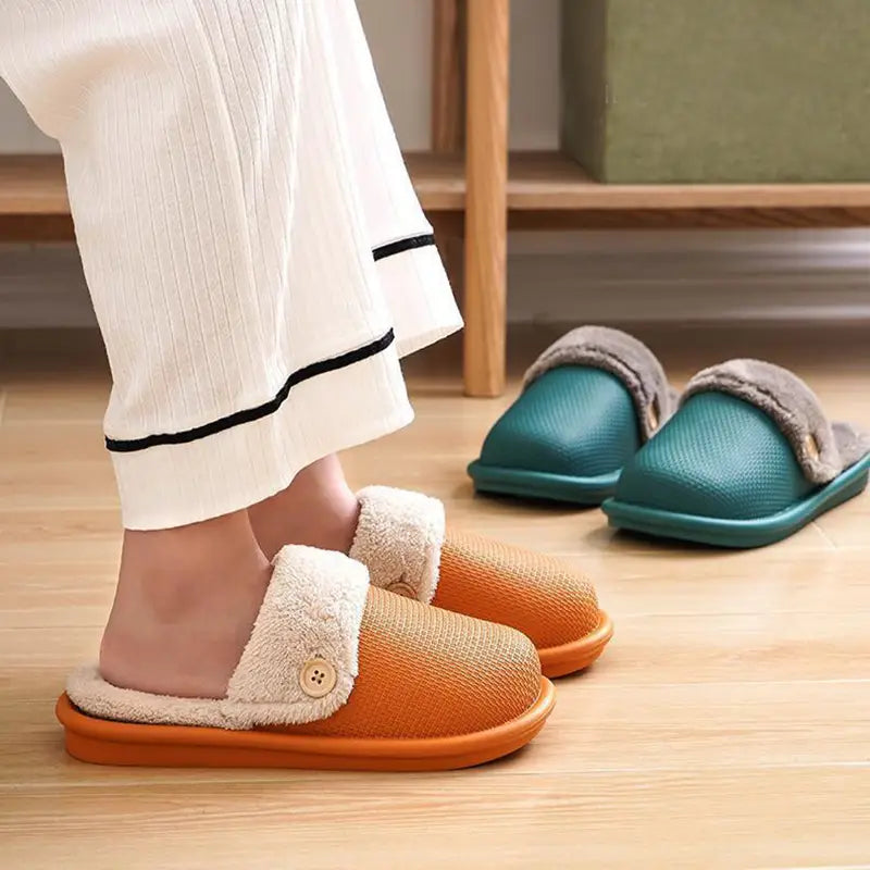 Winter slippers washable plush house shoes for women featuring orange and teal slip-on design with cream-colored fleece lining and textured fabric upper.