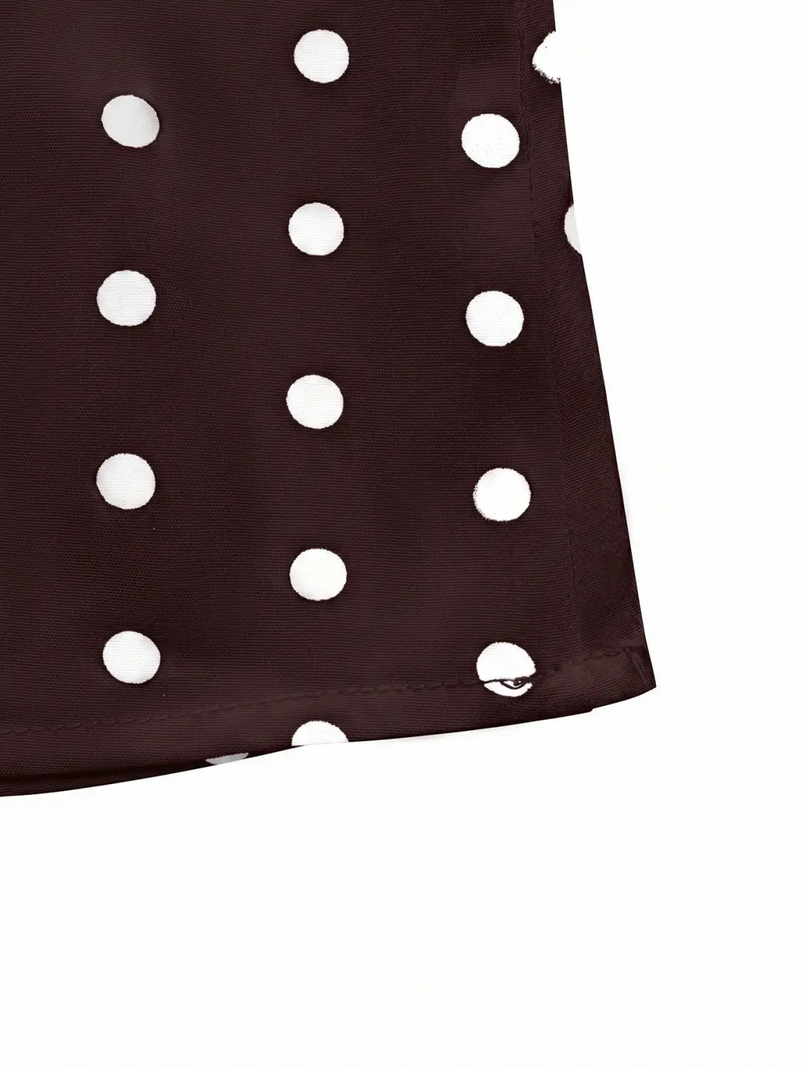 brown polka dot peplum camisole made of dark brown fabric with evenly spaced white polka dots.