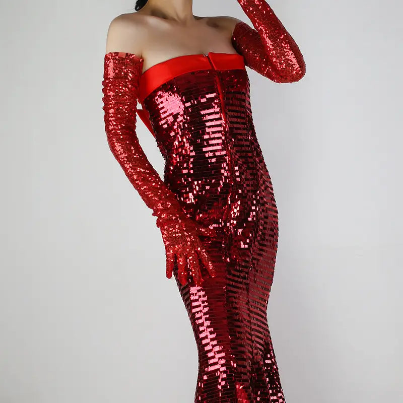 A shimmering red sequined off-the-shoulder gown paired with long matching sequined mesh finger gloves set.