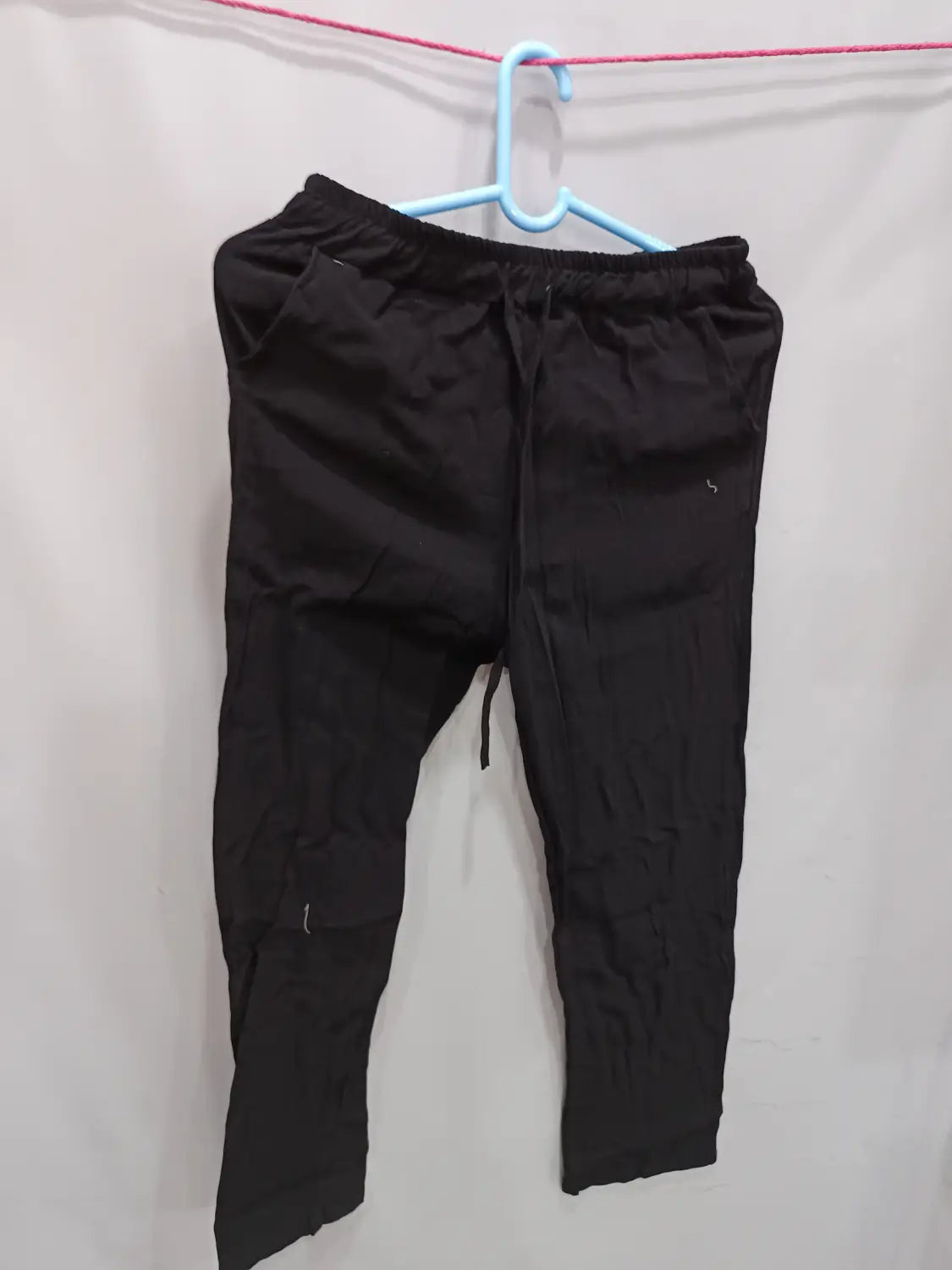 men’s black linen joggers with a relaxed fit and elastic waistband designed for casual summer wear