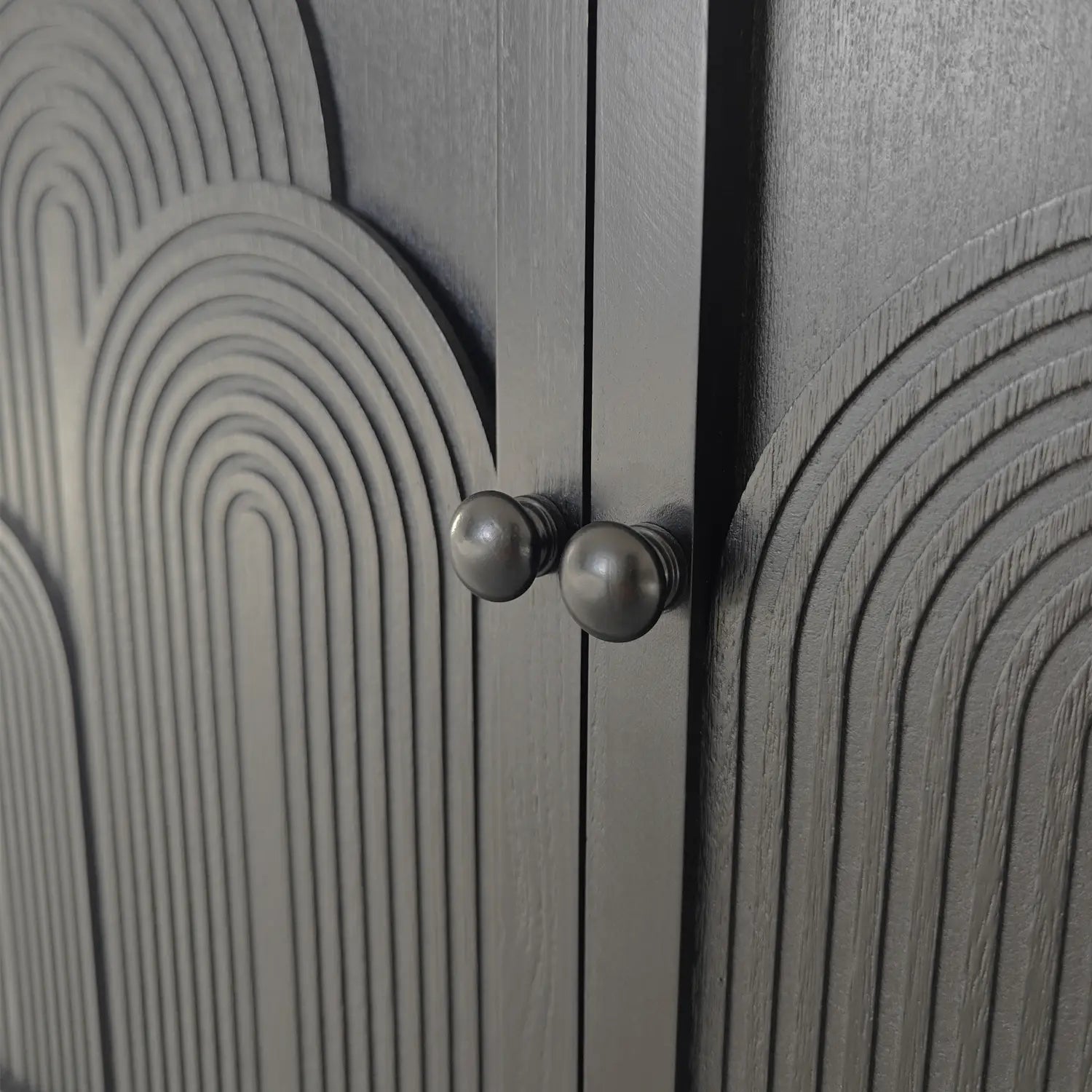 Dark gray wood storage cabinet 31in with curved concentric arc patterns and metallic round knobs.