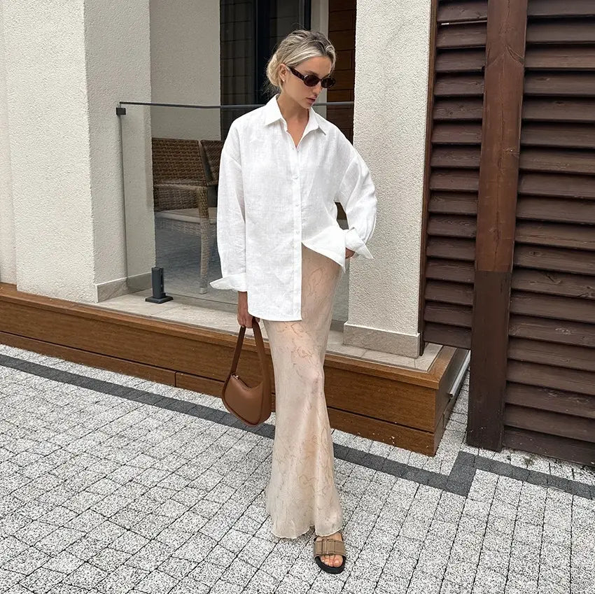 White oversized textured linen button up cardigan blouse with rolled sleeves and a relaxed fit for women