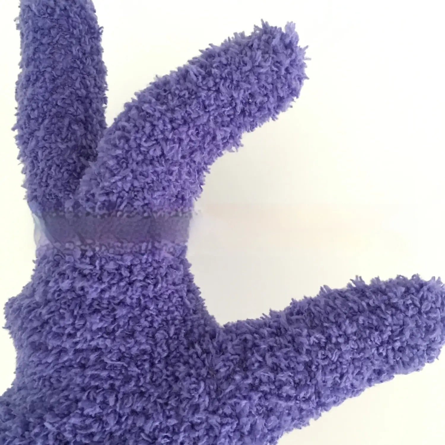 plush coral fleece bath dust gloves in purple featuring a fuzzy bunny shape made from soft coral fleece material.