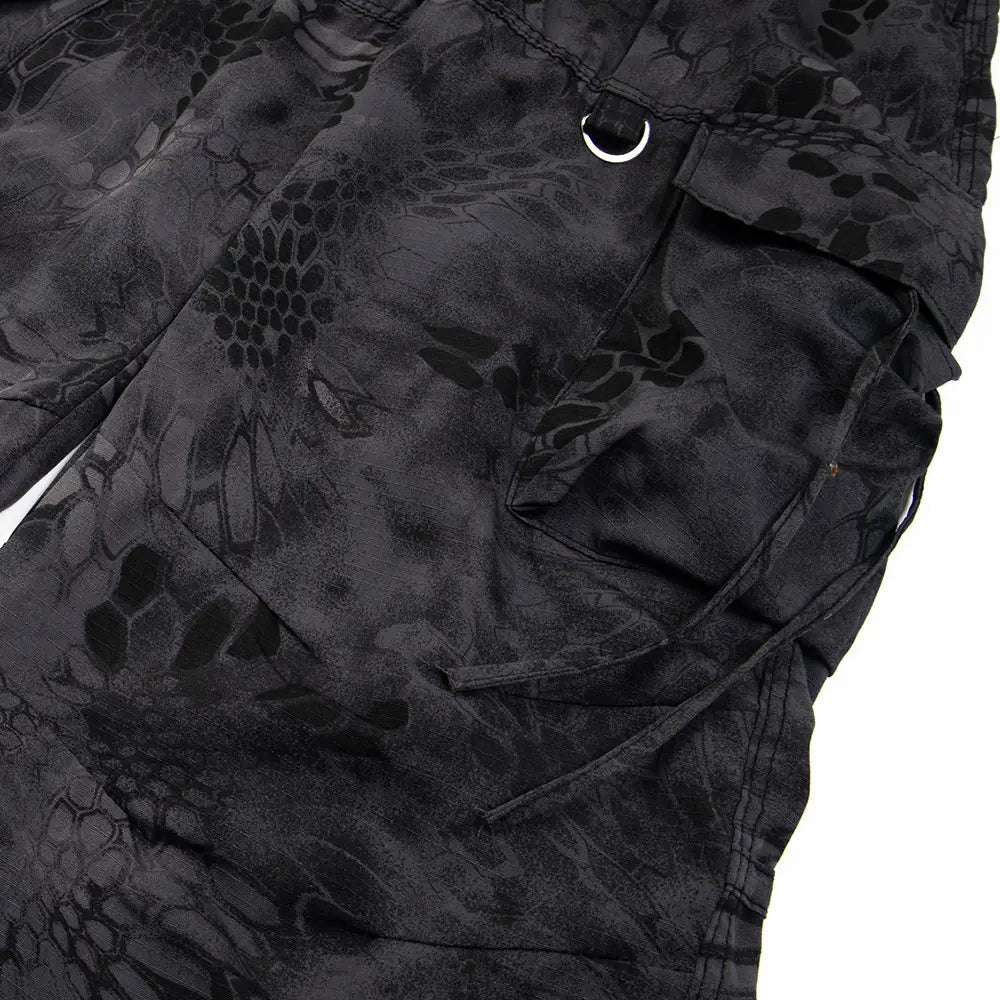black tactical cargo pants with wide leg design featuring a subtle dark-toned camouflage pattern multiple pockets and reinforced stitching suitable for tactical use