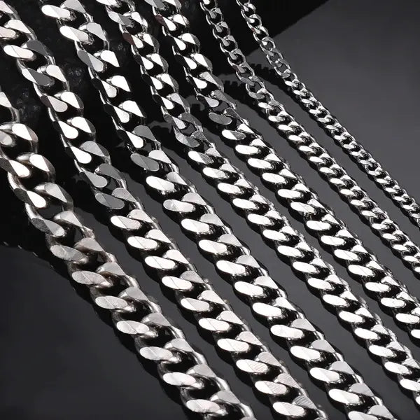 Unisex 18k gold plated stainless steel Cuban link necklace featuring a silver-toned stainless steel curb chain with a polished reflective finish and interlocking links.
