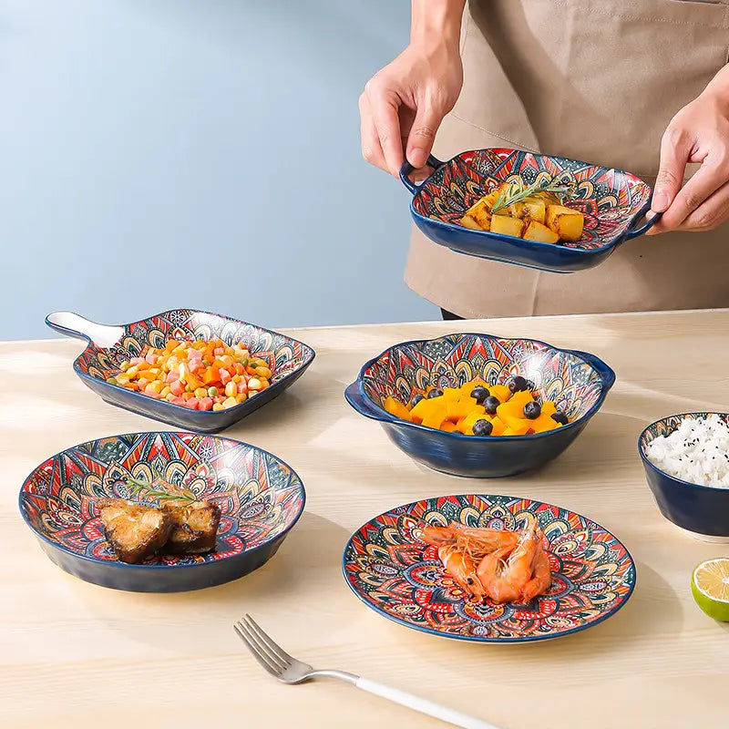 Ceramic mandala serving bowl hand painted with vibrant reds and golds on a deep blue glazed ceramic featuring intricate mandala patterns and a 400ml capacity.
