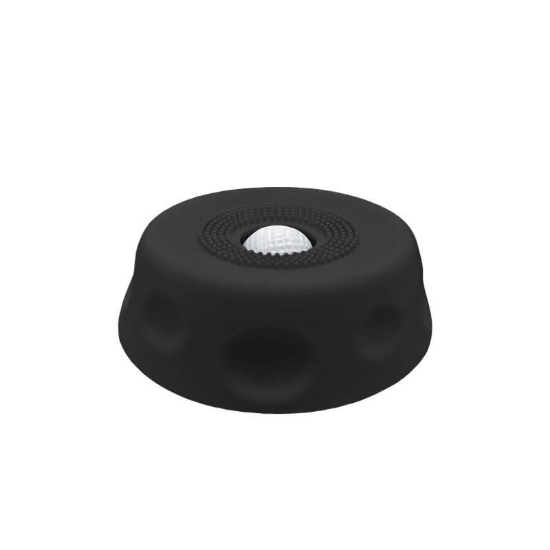 Tapis pour bol à lécher pour chien à alimentation lente en silicone noir, avec une balle de golf blanche centrale intégrée à sa surface texturée.