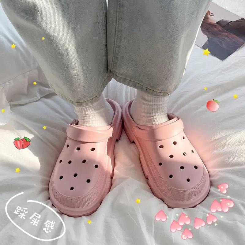 pink rubber unisex lightweight eva garden clogs and beach slippers with thick textured sole and circular perforations