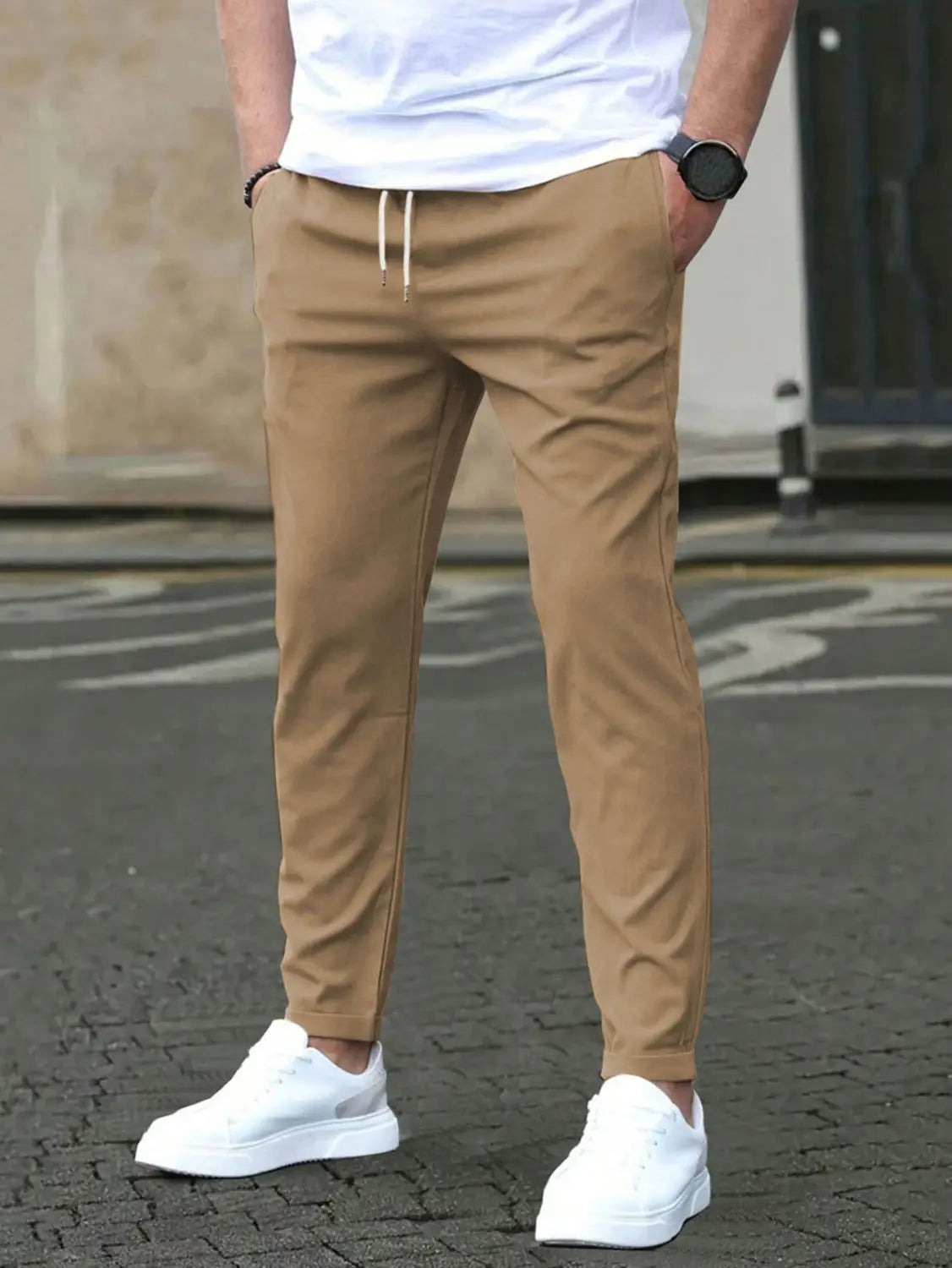 beige slim fit tapered jogger pants with drawstring featuring a comfortable fit and casual style for everyday wear.