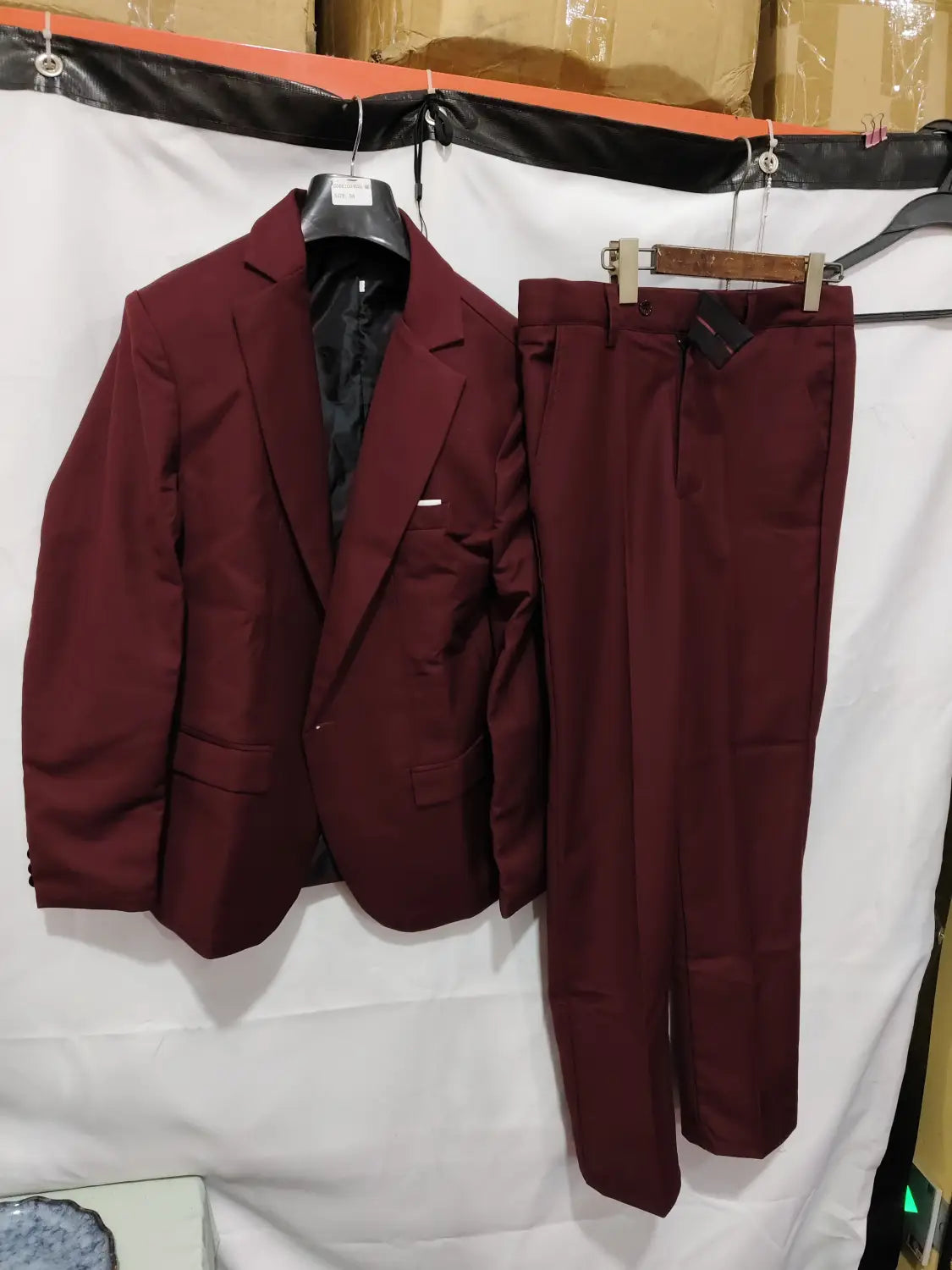 Men slim fit satin suit two piece in maroon featuring a smooth fabric blazer and matching trousers.