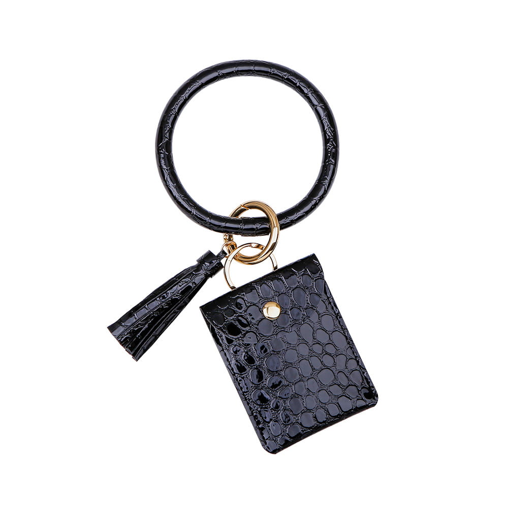 Porte-cartes avec mousqueton de poignet en cuir noir à texture de crocodile, avec portefeuille carré et gland.