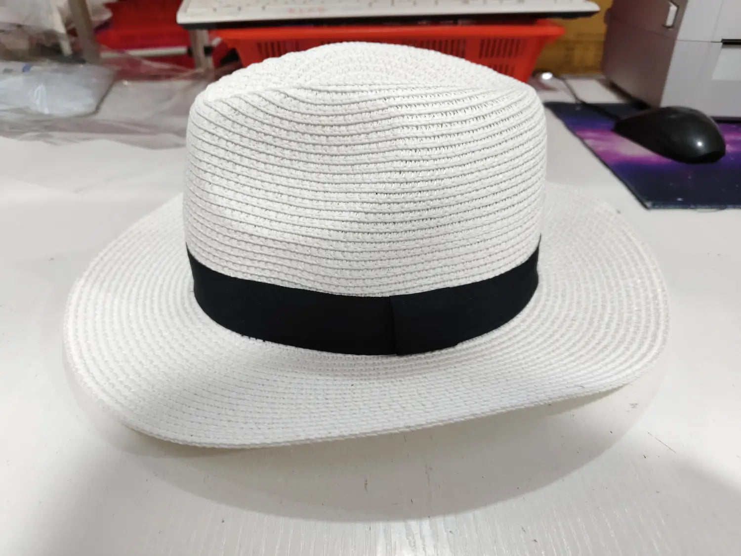 White straw fedora hat with black ribbon band foldable for sun protection for men.