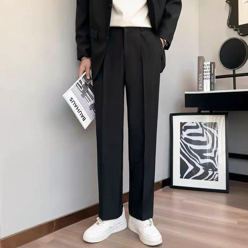 Black tailored loose fit straight leg suit pants featuring a sleek straight-leg cut with subtle pleats at the waistband.
