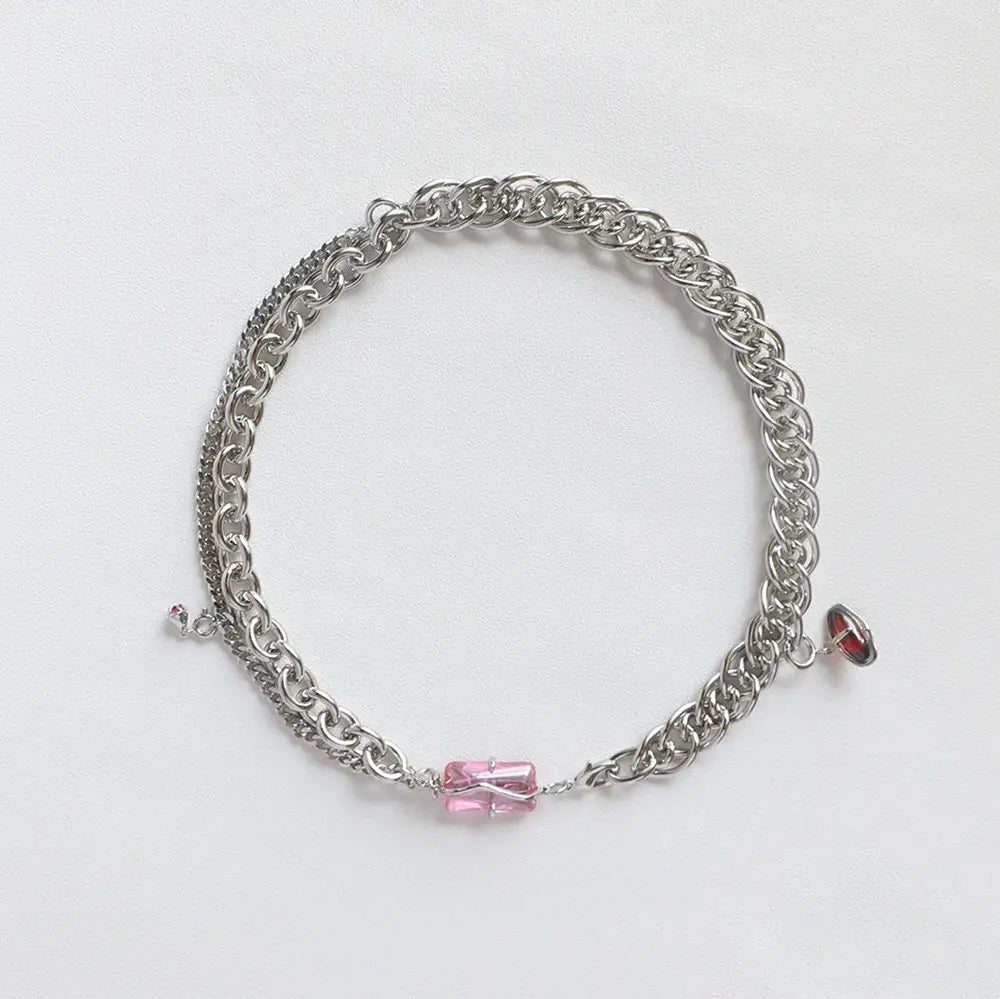 Layered silver opal and zircon crystal charm necklace featuring a layered design with pink and red crystal charms.