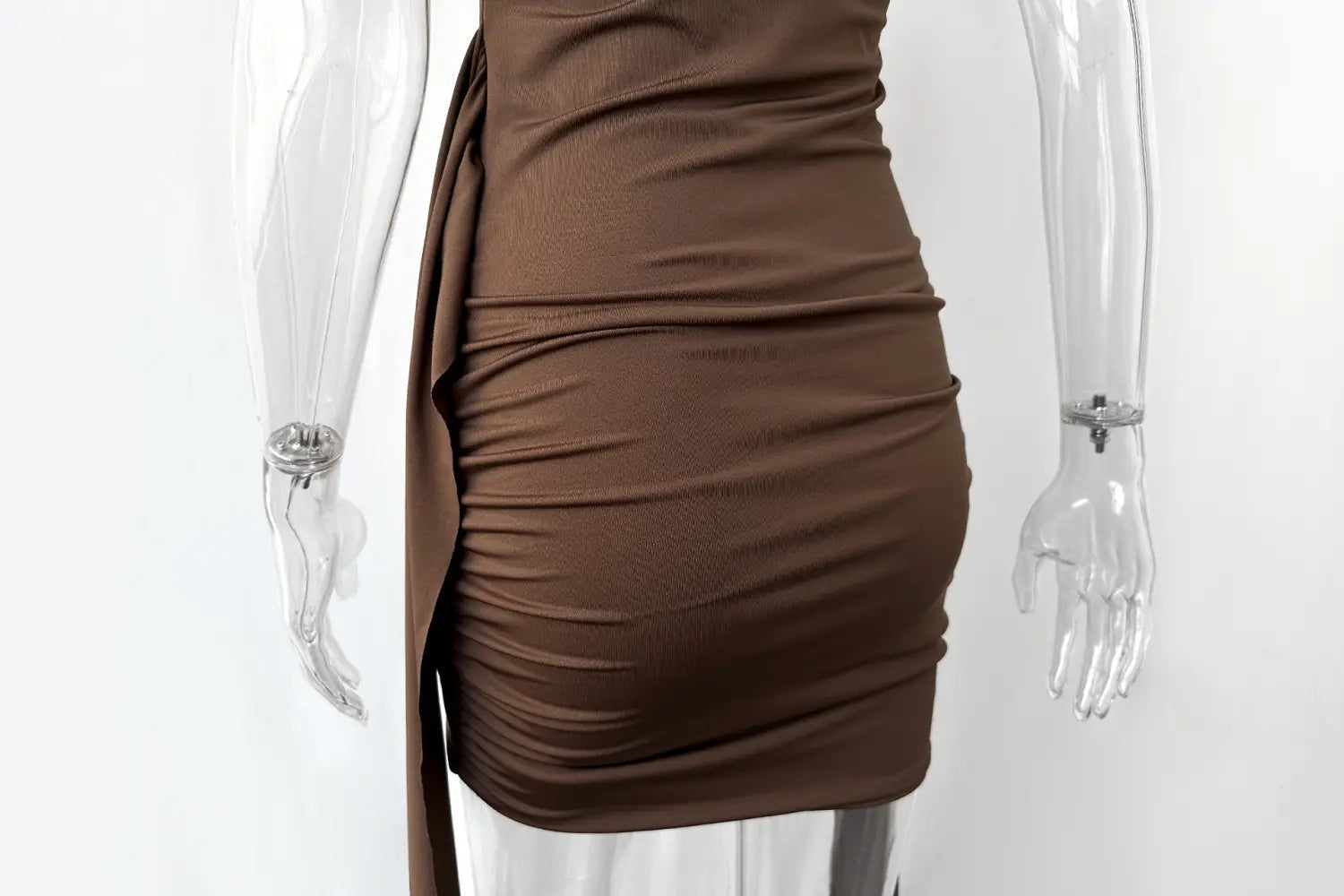 A form-fitting chocolate brown ruched mini dress with a high neck slim fit and side slit featuring draped fabric detail.